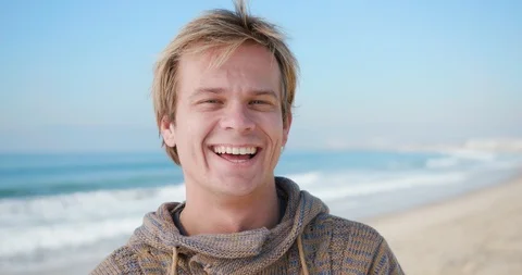 30's man portrait smiling at beach Stock Footage 127544560
