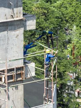 30th July 2017, workers work on high area in Bangkok, Thailand Stock Photos