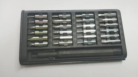 31-in-1 Precision Screwdriver Bit Set with Magnetic Handle in Black Compact Case Stock Photos