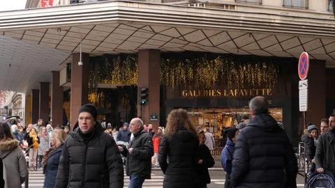 31 Rainy gray winter day Paris Lafayette Gallery entrance people crowd walkin Stock Footage 100813481