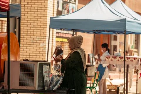 31.05.2021 Uzbekistan.Tashkent islamic women wearing hijabs walk through the Stock Photos