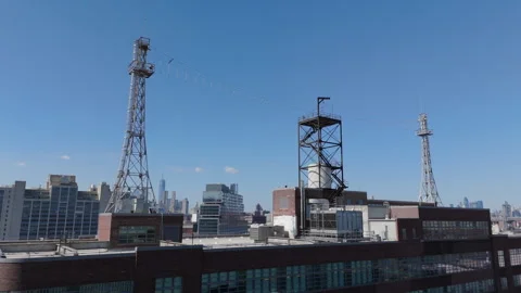 3/12/24 Brookly, NY, US - rising over rooftop antenna revealing Navy Yard Stock Footage 267932004