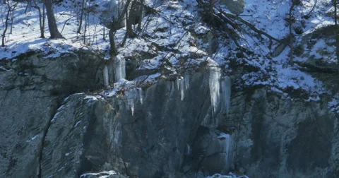 3148 Icicles Hanging off Rock Cliff Over River, 4K Stock Footage 47186909