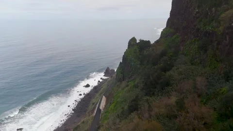 Cliff Edge meets the Atlantic Ocean, Arco de Sao Jorge, Madeira - Aerial Drone Cliff Edge meets the Atlantic Ocean, Arco de Sao Jorge, Madeira - Aerial Drone