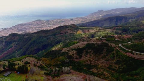 Madeira High Altitude Circling Aerial Drone, Forest and City of Funchal Madeira High Altitude Circling Aerial Drone, Forest and City of Funchal