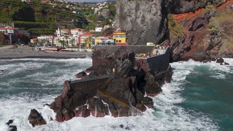 Pan back from Rocha Kamasora and Pier at Ponta do Sol, Madeira - Aerial Drone Pan back from Rocha Kamasora and Pier at Ponta do Sol, Madeira - Aerial Drone