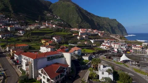 Rising up over rooftops in Porto Moniz, Madeira, Portugal - Aerial Drone Rising up over rooftops in Porto Moniz, Madeira, Portugal - Aerial Drone