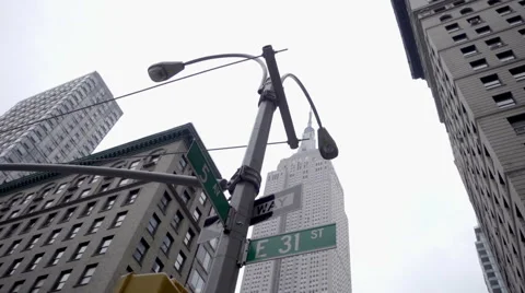 31st st and 5th Ave with Empire State Building street view NYC 1080 HD Stock Footage 63837059