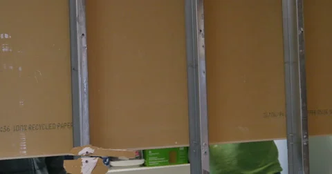 3200 Man Demolishing and Punching Dry Wall During Construction, 4K Stock Footage 47581340