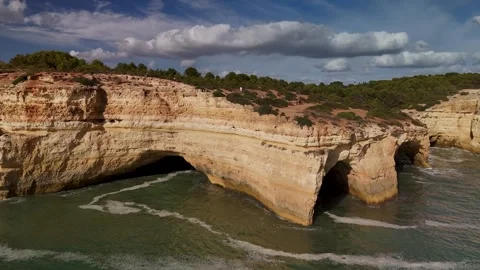 Rising up over the Benagil Sea Cave, Algarve, Portugal - Aerial Drone Rising up over the Benagil Sea Cave, Algarve, Portugal - Aerial Drone