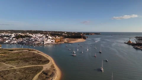 Approach to Ferragudo over Arade River, Algarve, Portugal - Aerial Drone Approach to Ferragudo over Arade River, Algarve, Portugal - Aerial Drone