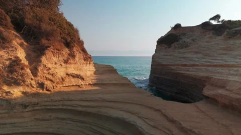 Close Drone Flight Over Rock Formation at Canal d'Amour Out to Sea Close Drone Flight Over Rock Formation at Canal d'Amour Out to Sea