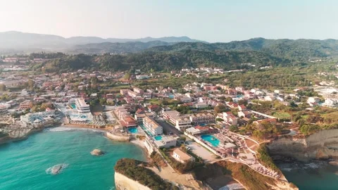 Wide Aerial Panning Shot Over Sidari Resort Town and Coastline Wide Aerial Panning Shot Over Sidari Resort Town and Coastline