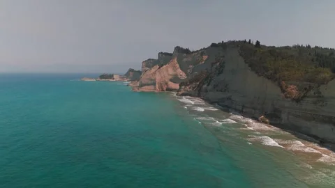 Drone Pan Shot of Majestic Loggas Cliffs and Ionian Sea, Corfu Drone Pan Shot of Majestic Loggas Cliffs and Ionian Sea, Corfu