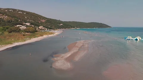 Flying Low Over Sandy Beach at Low Tide, Paralia Kalamaki, Corfu Flying Low Over Sandy Beach at Low Tide, Paralia Kalamaki, Corfu
