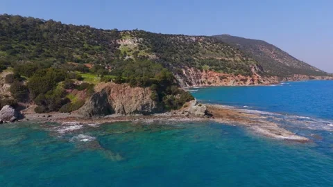 Dynamic Pan Around Cyprus Coastline Revealing Green Lagoon Cove
