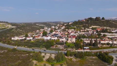 Drone Descent into Alassa Village Over Busy Highway Road, Cyprus