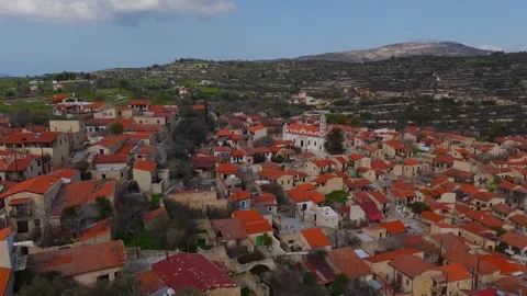Aerial Flight Over Traditional Lofou Village Towards Historic Church, Cyprus
