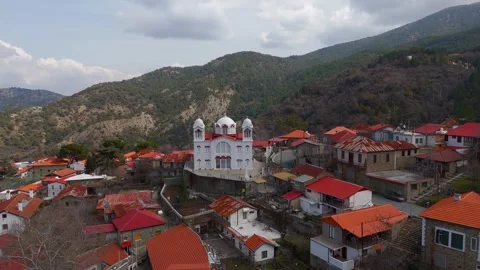 Drone Pan Across Snow Covered Church of Holy Cross Pedoulas, Cyprus