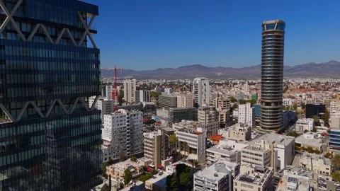 Drone Flies Past Nicosia Skyscrapers Towards Historic Old Walled City, Cyprus
