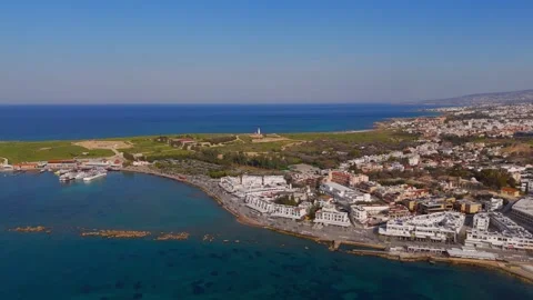 High Wide Aerial Approach to Historic Paphos Lighthouse on Coast