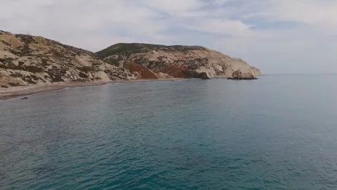 Aerial Approach to Petra tou Romiou Coastline on Overcast Winter Day