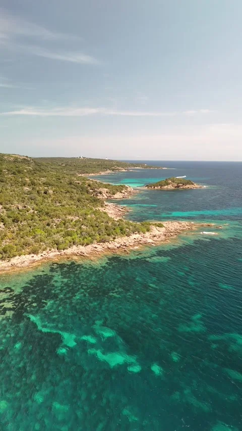 Aerial Flight Over Sea Towards Ile de Farina, Corsica Coast