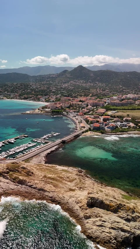 Vertical Aerial Flight Over Marina Towards L'Île-Rousse Town, Corsica