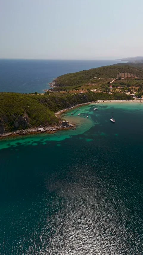 Aerial Pan of Vrasidas Peninsula Coastline near Nea Peramos, Greece