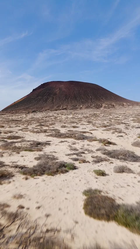 Drone Shot Approaching Montaña Amarilla Volcano on La Graciosa Island Drone Shot Approaching Montaña Amarilla Volcano on La Graciosa Island