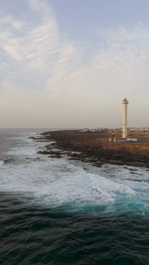 Aerial Approach to Faro de Pechiguera Lighthouse, Volcanic Coast