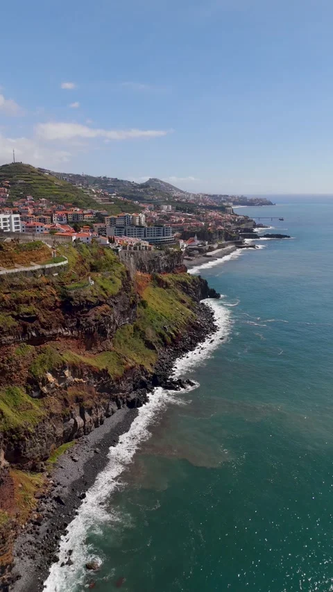 Vertical Drone View Flying Towards Câmara de Lobos Town, Madeira Coast Vertical Drone View Flying Towards Câmara de Lobos Town, Madeira Coast