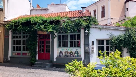Pan Across Dilapidated Traditional House Covered in Greenery, Xanthi