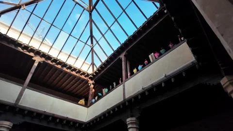 Pan Across Historic Spanish Patio with Modern Glass Atrium Covering