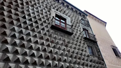 Pan Across the Unique Facade of Casa de los Picos in Segovia, Spain
