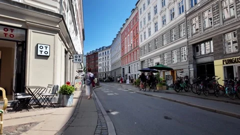 Busy Elmegade Street View with Cyclists and Colorful Apartments, Copenhagen Busy Elmegade Street View with Cyclists and Colorful Apartments, Copenhagen