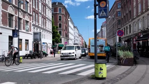 Busy Copenhagen City Street Scene with Traffic, Bus, Cyclists, and Pedestrians Busy Copenhagen City Street Scene with Traffic, Bus, Cyclists, and Pedestrians