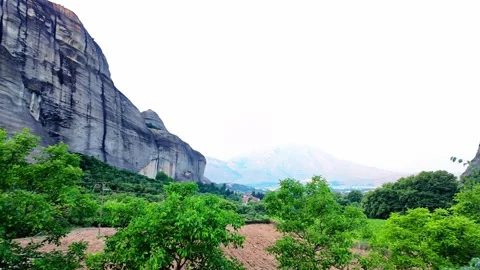 Pan Between Towering Meteora Rock Formations in Greece Valley