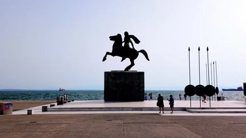 Alexander the Great Statue Silhouette Against Low Sun and Sea