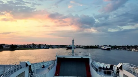 Sunrise Leaving Keramoti Port: Ferry View Back Towards Mainland Greece Sunrise Leaving Keramoti Port: Ferry View Back Towards Mainland Greece