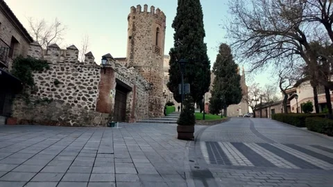 Walking Uphill Towards Palacio de los Duques de Maqueda in Historic Toledo Walking Uphill Towards Palacio de los Duques de Maqueda in Historic Toledo