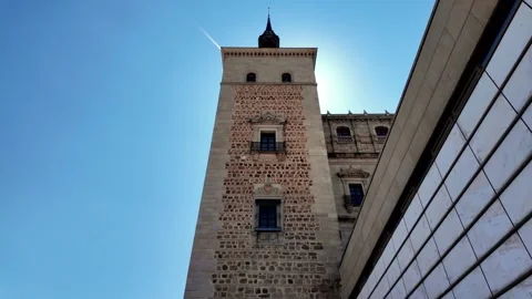 Looking Up at Alcázar Tower Against Sunny Blue Sky in Toledo Looking Up at Alcázar Tower Against Sunny Blue Sky in Toledo