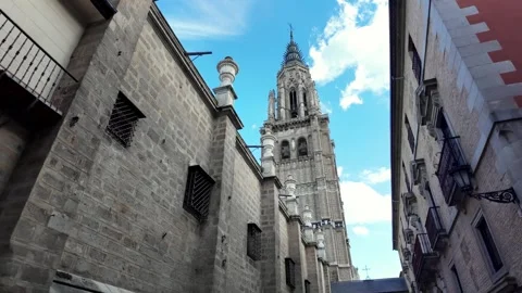 Walking Towards the Tower of Catedral Primada de Toledo on a Sunny Day Walking Towards the Tower of Catedral Primada de Toledo on a Sunny Day