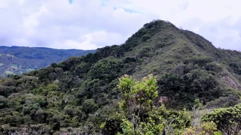 Cloudy Skies Over Historic Guatavita Hills, Lush Colombian Landscape