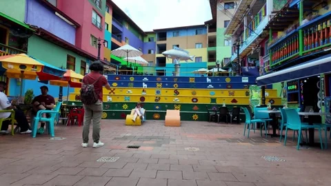 Rising Shot of Vibrant Plazoleta de Los Zócalos Square in Guatape Town