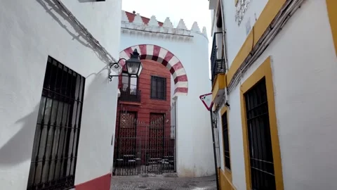 POV Walk towards Moorish Islamic Archway in Córdoba Old Town Street POV Walk towards Moorish Islamic Archway in Córdoba Old Town Street