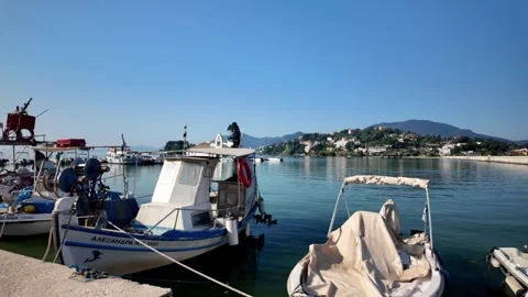 Walking Along Waterfront Marina Towards Vlacherna Monastery in Corfu Walking Along Waterfront Marina Towards Vlacherna Monastery in Corfu