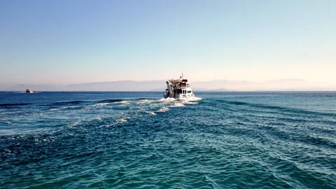 Tourist Boat Leaving Lefkimmi Port, Corfu, Heading Out to Ionian Sea Tourist Boat Leaving Lefkimmi Port, Corfu, Heading Out to Ionian Sea