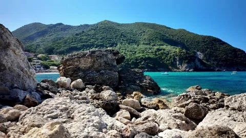 Slow Pan View from Rocks Across Ermones Bay and Open Ionian Sea Slow Pan View from Rocks Across Ermones Bay and Open Ionian Sea