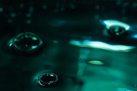 323.Three Bubbles on Glossy Teal-Green Liquid Surface Stock Photos